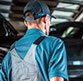 auto glass technician figuring out the problem with side window glass inside Speers Auto Glass shop