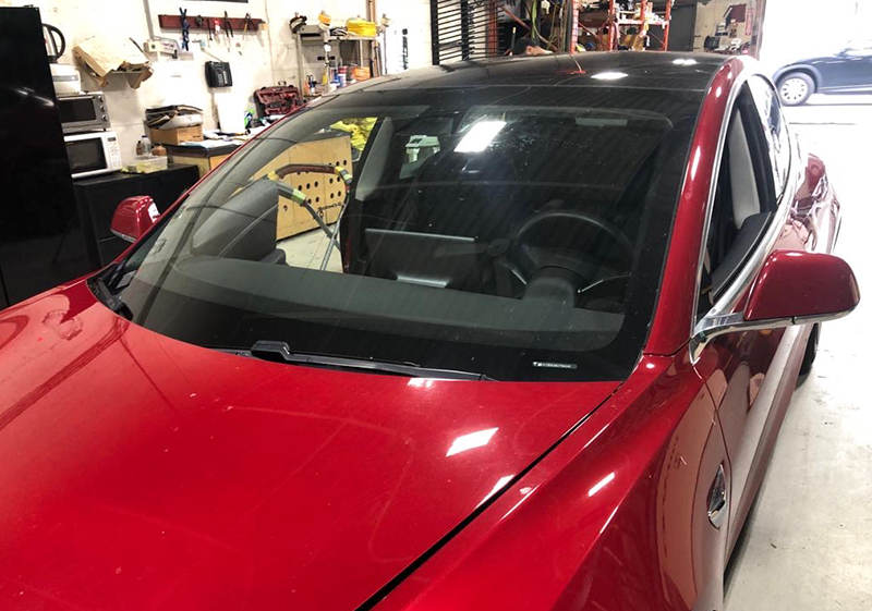 auto glass work Burlington gallery in shop windshield replace for red model 3 Tesla by Speers Auto Glass