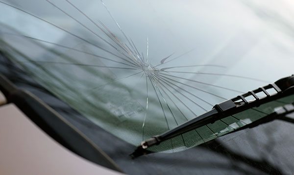 closed up shot of spider cracks on windshield by Speers Auto Glass